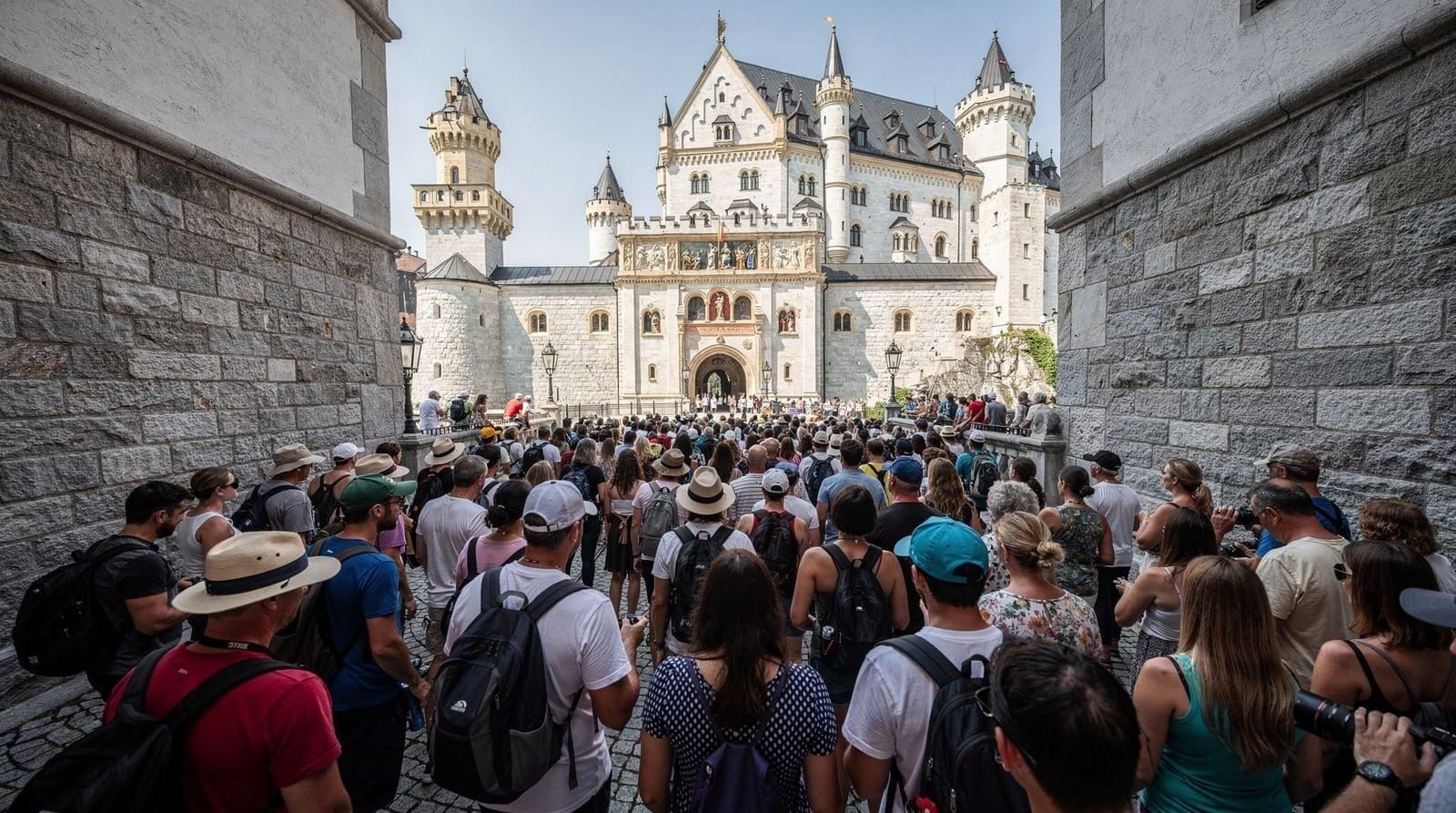 Neuschwanstein crowds: the honest guide to visiting without regret — Timed tickets sell out months ahead, the uphill walk is 30-40 min, no photos ins